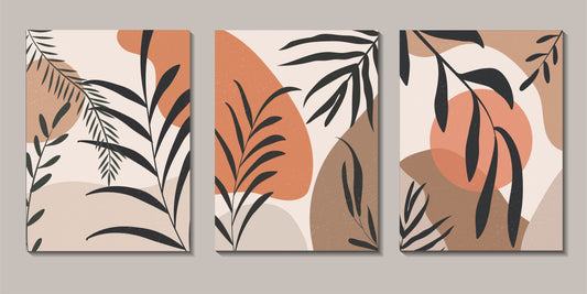 Three abstract wall art panels with leaf patterns on a beige background