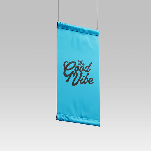 A blue hanging banner with the text 'The Good Vibe' on it